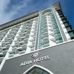 Adya Hotel Langkawi featuring a modern high-rise hotel with contemporary architecture, glass balconies, stylish guest accommodations, and a convenient location in Kuah Town.