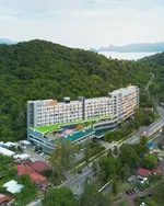 Aloft Langkawi Pantai Tengah featuring a modern hillside resort with contemporary architecture, an elevated infinity pool, lush rainforest surroundings, and scenic views toward the Andaman Sea near Pantai Tengah.