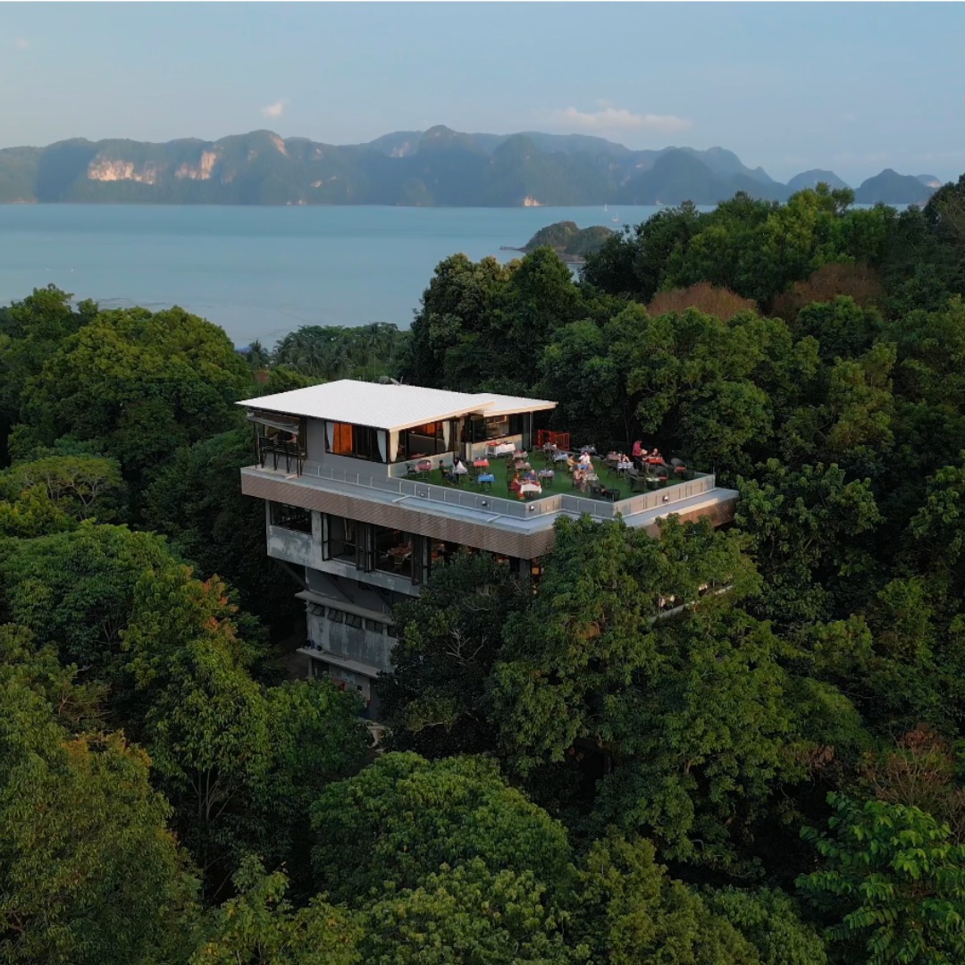 Ambong Ambong Rainforest Retreat featuring a luxury hillside retreat surrounded by lush rainforest, a modern elevated building with a rooftop terrace, and panoramic views of the Andaman Sea in Langkawi.