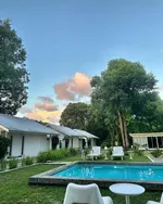 Charming boutique resort with a small outdoor pool, surrounded by greenery and white minimalist villas at La Pari-Pari Langkawi.