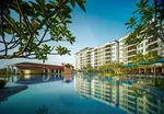 Dayang Bay Resort Langkawi featuring a spacious lagoon-style infinity pool, modern waterfront accommodations, tropical landscaping, and scenic views overlooking Kuah Bay in a relaxing resort setting.
