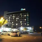 HIG Hotel & Convention Langkawi featuring a modern multi-story hotel illuminated at night, with contemporary accommodations, on-site convention facilities, ample parking, and a convenient location in Kuah Town.